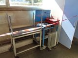 a room that has a table and a radiator in it