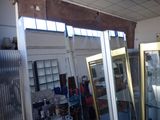 a room with a lot of glass doors in it