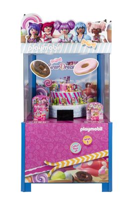 un gros plan sur un distributeur automatique de jouets proposant des bonbons et des beignets