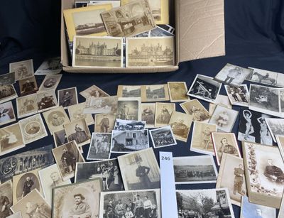 an old photo of a bunch of old photos in a box on a table
