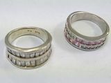 two rings sitting next to each other on a table