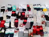 many pairs of men ' s socks on the table