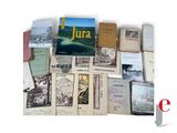 a lot of books that are sitting on a table