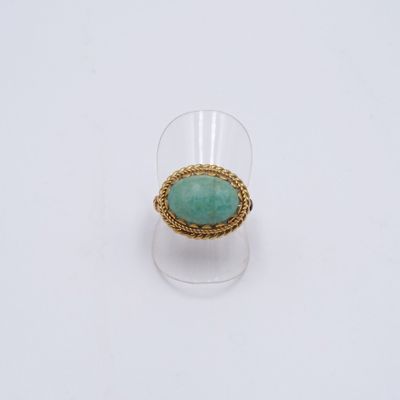 une image représentant une bague en or sertie d'une pierre turquoise