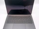 a laptop with a broken screen sitting on a table