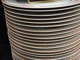 many plates stacked on top of each other on a table