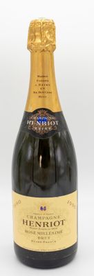 an image of a bottle of champagne sitting on top of a table