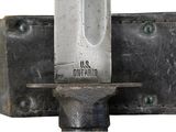 a close up of a metal object with a knife on it