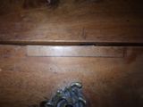 a close up of a wooden drawer with a metal handle