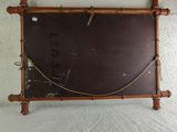 a wooden frame with a rope hanging on it