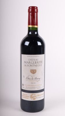 the bottle of wine is sitting on the table ready to be eaten
