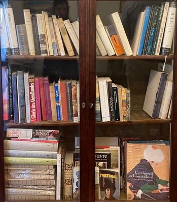 a book case with many books on top of it