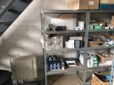 a room with a lot of boxes and boxes on the shelves