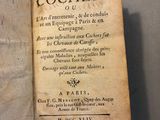 an old book with writing on it sitting on a table