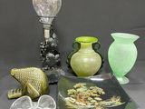 a lot of glass items that are on a table
