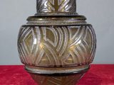 a vase that is sitting on a red surface