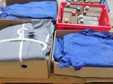 several boxes of clothing are stacked on top of a pallet