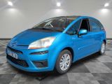 a picture of a blue car parked in a garage