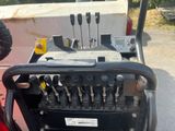a close up of a tractor with a bunch of tools in it