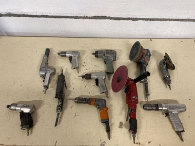 a lot of tools that are laying out on the floor