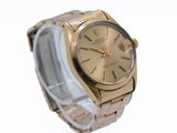 a gold watch with roman numerals on the face