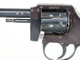 an old revolver with a metal barrel on a white background