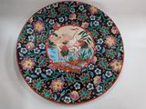 an image of a decorative plate with a painting on it