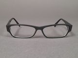 a pair of glasses sitting on a table next to each other