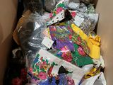 a cardboard box filled with many different types of clothing