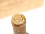 a close up of a bottle of wine on a table