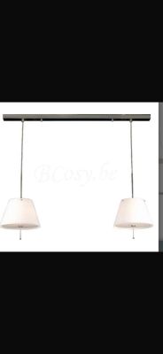 two lights hanging from a ceiling in a room with a white wall