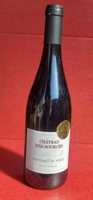 a bottle of wine that is sitting on a table