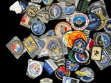many different types of military badges on a black background