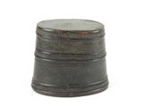 a small metal container with a lid on a white surface