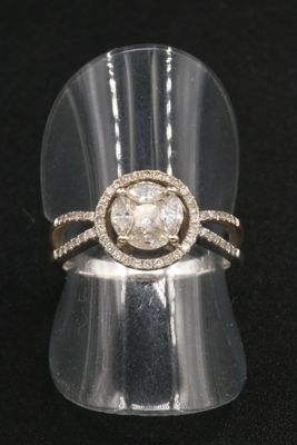 an image of a diamond ring on a clear ring holder
