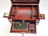 a small wooden box with a mirror on top of it