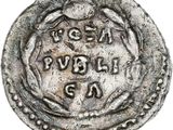 une vieille pièce d'argent sur laquelle est gravé le portrait d'un homme