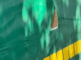 a green and yellow wall with a yellow stripe on it