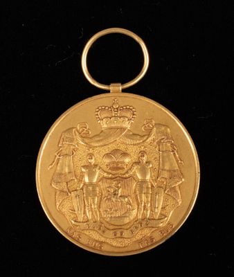 an image of a gold medal on a black background