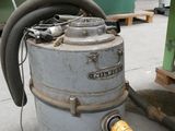 a large industrial dust collector sitting on the floor