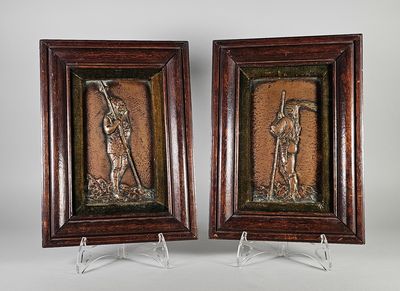 une paire de bas-reliefs en bronze représentant un homme et une femme