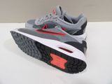 the nike air max is a grey and red shoe with a white sole