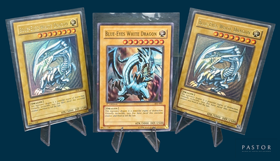 three cards are on display on a stand with a blue background
