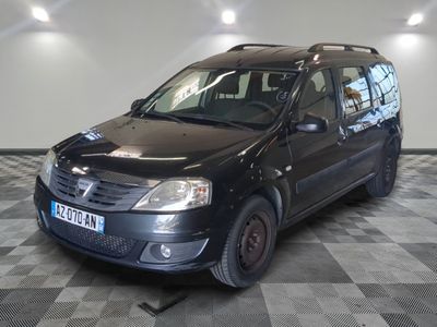 a picture of a small black car parked in a garage