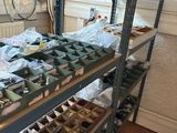 many shelves with various items on them in a room