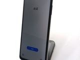 a black phone that is sitting on top of a stand