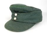 an image of a green hat with buttons on it