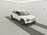 the white car is parked in the garage on the checkered floor