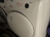 a washer and dryer sitting on the floor next to each other