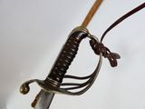 a close up of a sword with a rope on it